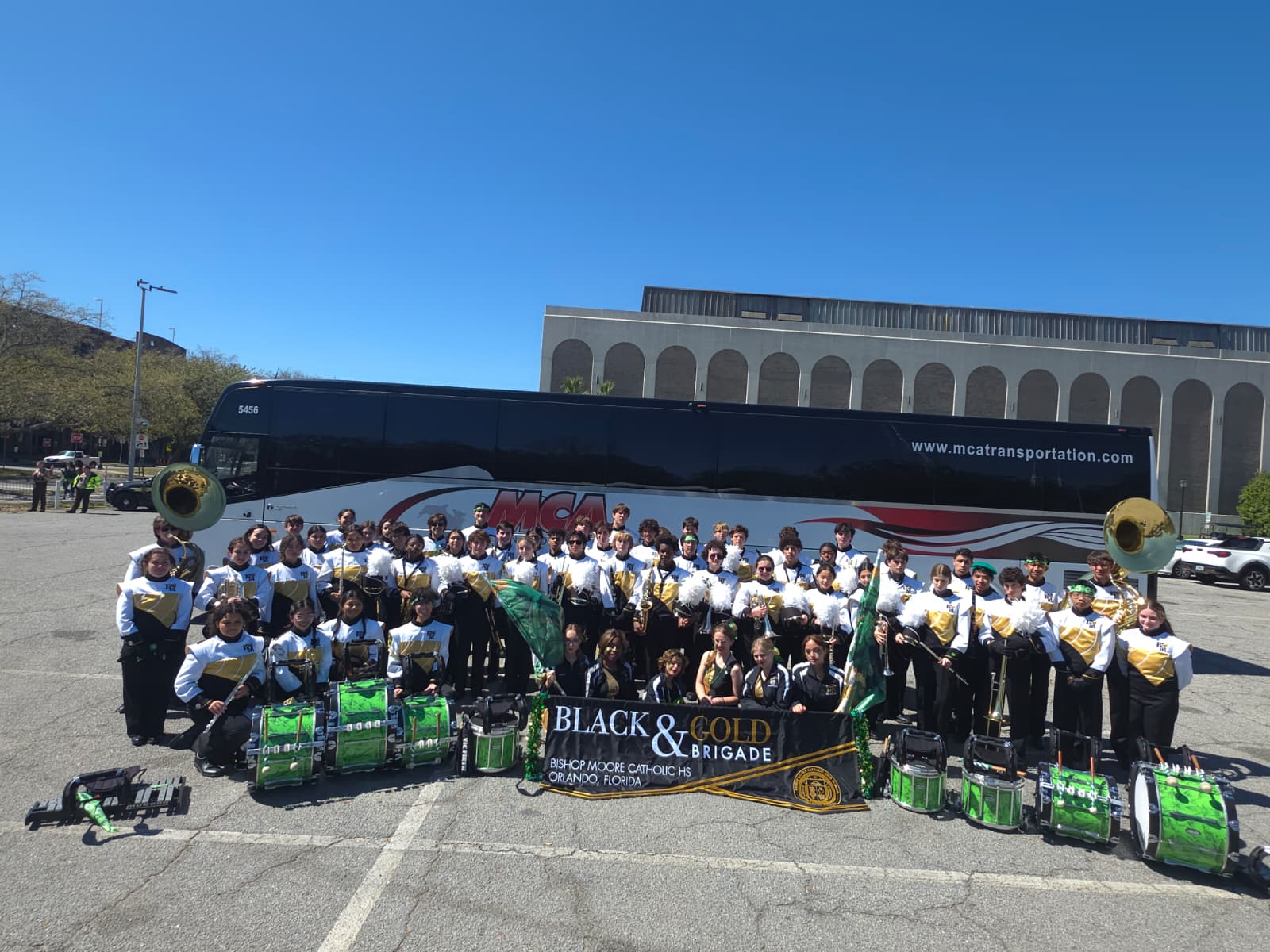 Bishop Moore Catholic High School band with an MCA Transportation motorcoach