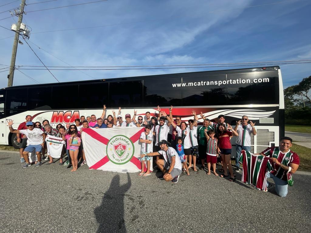 Fluminense supporters group with an MCA Transportation motorcoach