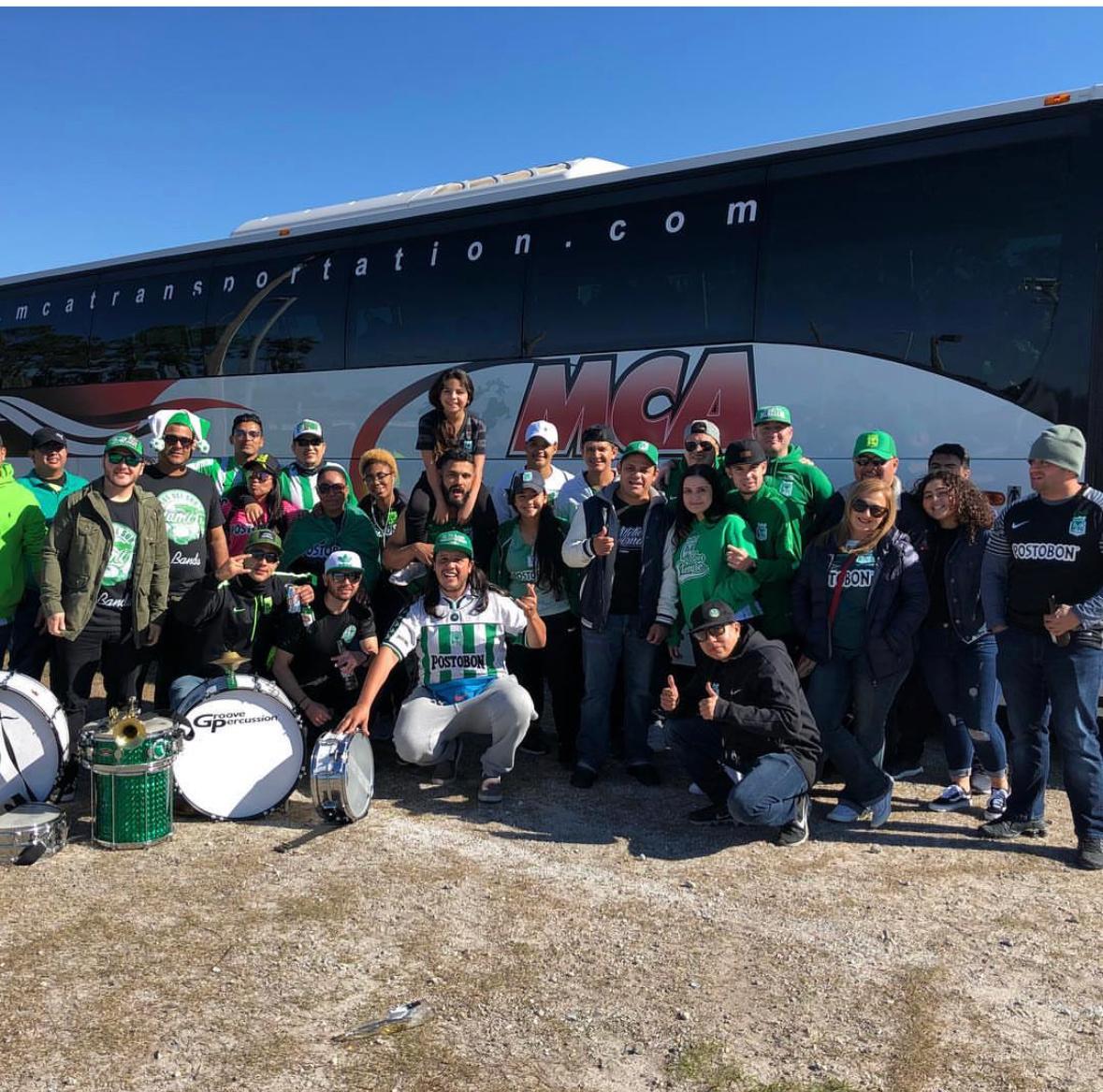 Sports supporters group with an MCA Transportation motorcoach