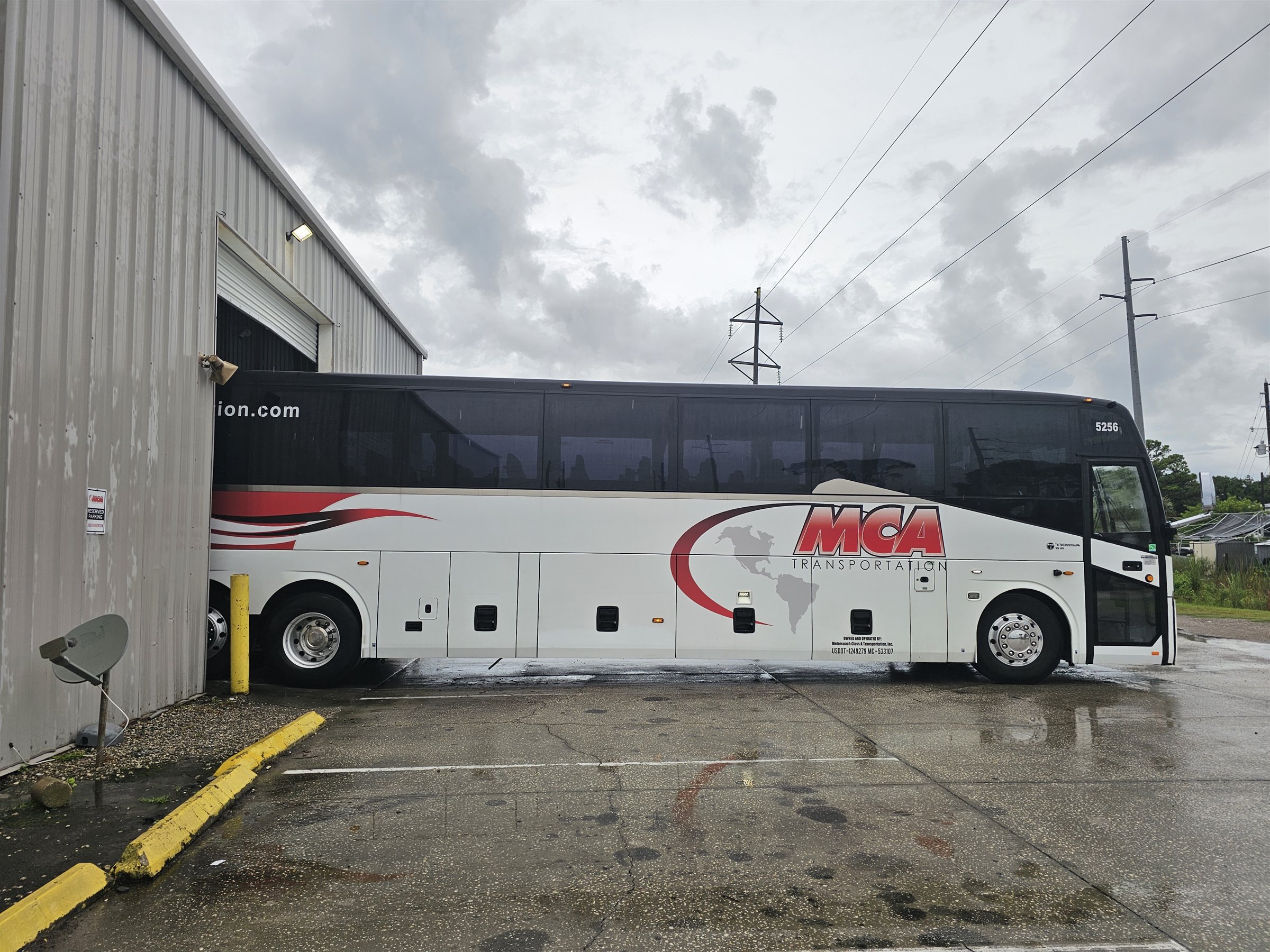 MCA Transportation motorcoach outside the in-house body shop